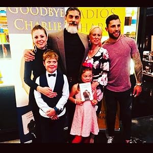 Carlos Camacho at a book signing with his family.